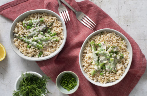 Brown rice topped with a lemon butter sauce with asparagus and peas