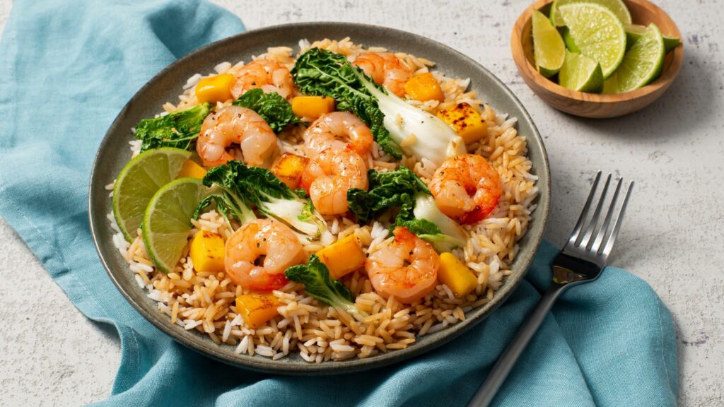 shrimp fried rice with fresh mango bok choy ginger root and lime